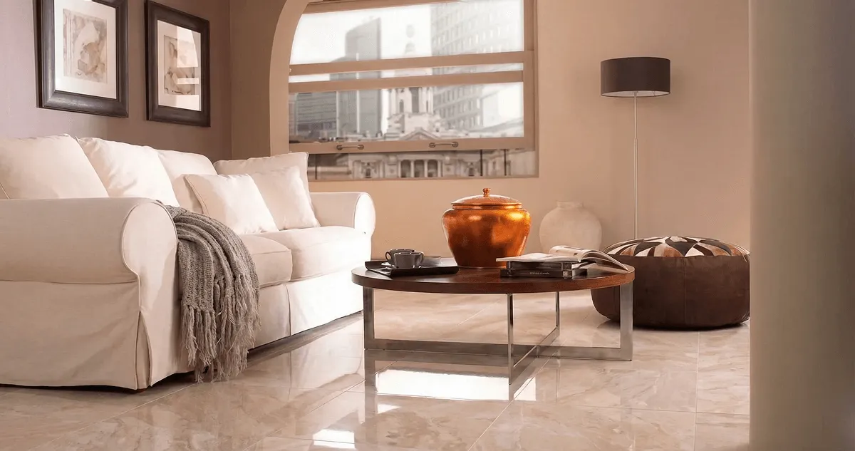 Modern living room with professionally installed marble flooring, a beige sofa, coffee table in Minneapolis, MN