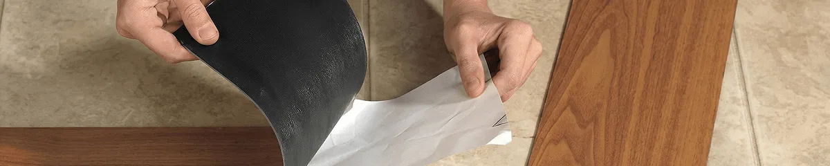 A professional installing vinyl flooring in Minneapolis, MN